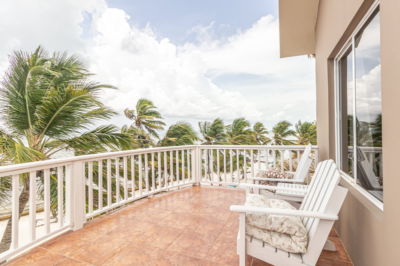 balcony sun chairs ocean view sapphire beach ambergris caye belize